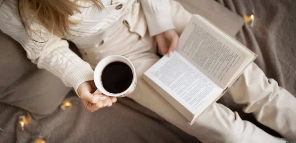 close-up-woman-reading-home-with-coffee_23-2149304916 Між роботою та життям: як знайти час на саморозвиток
